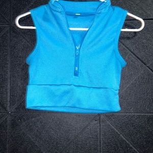 Blue zip up. Cropped.
